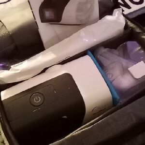 Portable Black and White Electronics Device 50 Percent Off Original Price